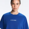 Camisas curtas e largas em mistura de algodão com slogan