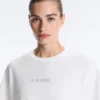 Camisas curtas e largas em mistura de algodão com slogan Camisas curtas e largas em mistura de algodão com slogan