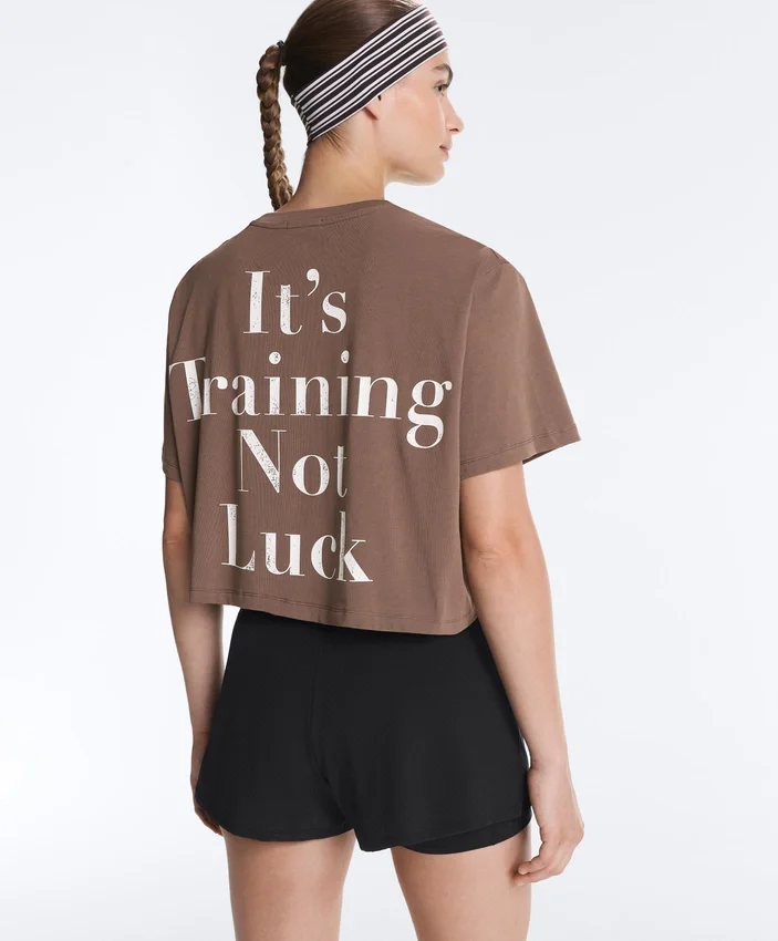 Camisas curtas e largas em mistura de algodão com slogan Camisas curtas e largas em mistura de algodão com slogan