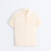 Camisas polo de malha com aberturas e manga curta