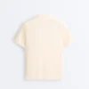 Camisas polo de malha com aberturas e manga curta