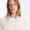 Camisola com decote em V em malha trançada 100% algodão Camisola com decote em V em malha trançada 100% algodão