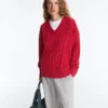 Camisola com decote em V em malha trançada 100% algodão Camisola com decote em V em malha trançada 100% algodão