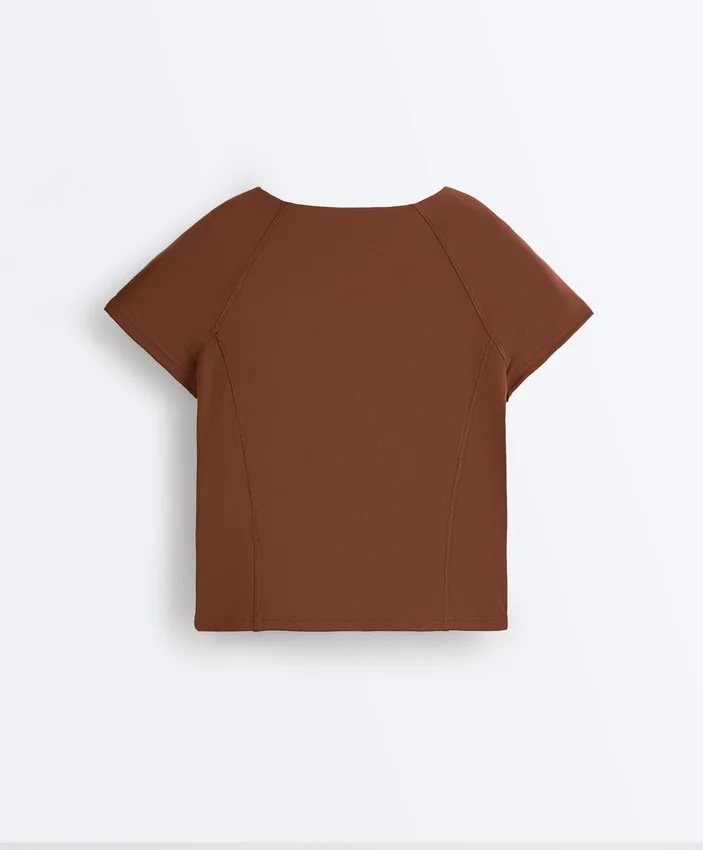 Camisola de manga curta com fecho Camisola de manga curta com fecho