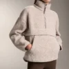 Camisola em imitação de casacos de pelo de carneiro com bolso frontal