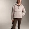 Camisola em imitação de casacos de pelo de carneiro com bolso frontal