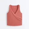 Camisola sem mangas Comfortlux com decote cruzado Camisola sem mangas Comfortlux com decote cruzado
