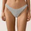 Cueca de biquínis com corte em U e cobertura média em jacquard às bolinhas Cueca de biquínis com corte em U e cobertura média em jacquard às bolinhas