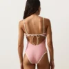 Fato de banho bandeau com acabamentos contrastantes Fato de banho bandeau com acabamentos contrastantes