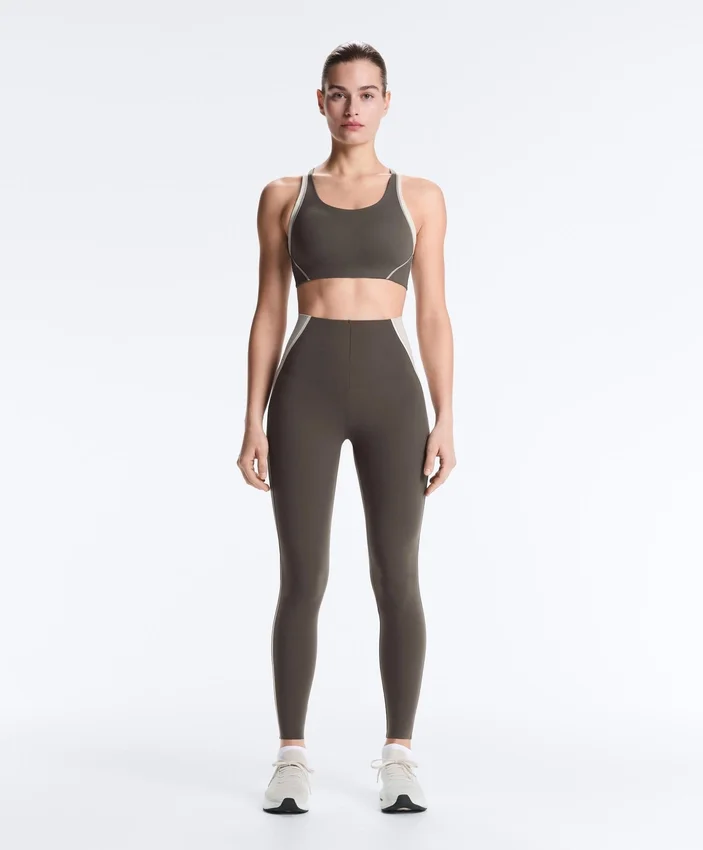 Sutiã desportivo compressivo de apoio firme com detalhes refletores Sutiã desportivo compressivo de apoio firme com detalhes refletores