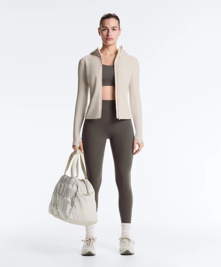 Sutiã desportivo compressivo de apoio firme com detalhes refletores Sutiã desportivo compressivo de apoio firme com detalhes refletores