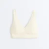 Sutiã desportivo Comfortlux de suporte médio com bainha em ponto de alinhavo Sutiã desportivo Comfortlux de suporte médio com bainha em ponto de alinhavo