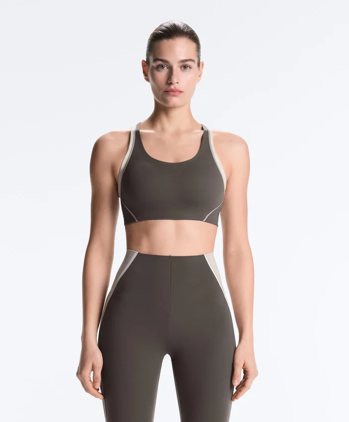 Sutiã desportivo compressivo de apoio firme com detalhes refletores Sutiã desportivo compressivo de apoio firme com detalhes refletores