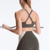 Sutiã desportivo compressivo de apoio firme com detalhes refletores Sutiã desportivo compressivo de apoio firme com detalhes refletores