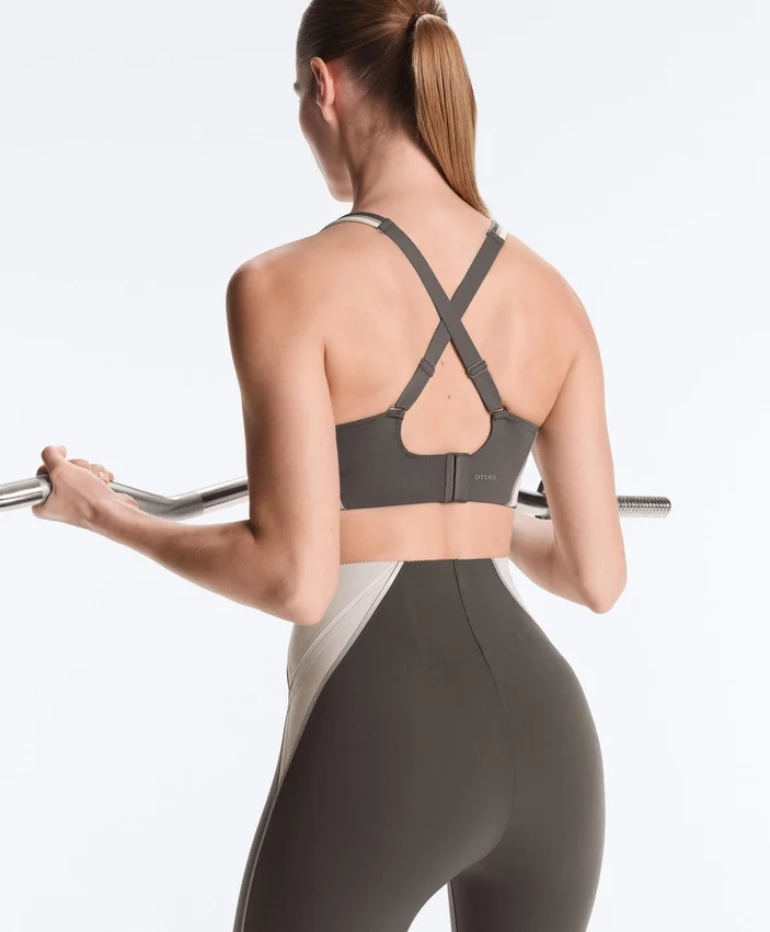 Sutiã desportivo compressivo de apoio firme com detalhes refletores Sutiã desportivo compressivo de apoio firme com detalhes refletores