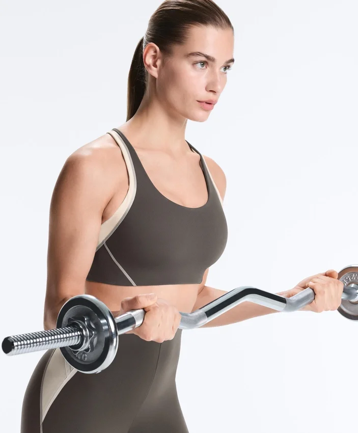 Sutiã desportivo compressivo de apoio firme com detalhes refletores Sutiã desportivo compressivo de apoio firme com detalhes refletores