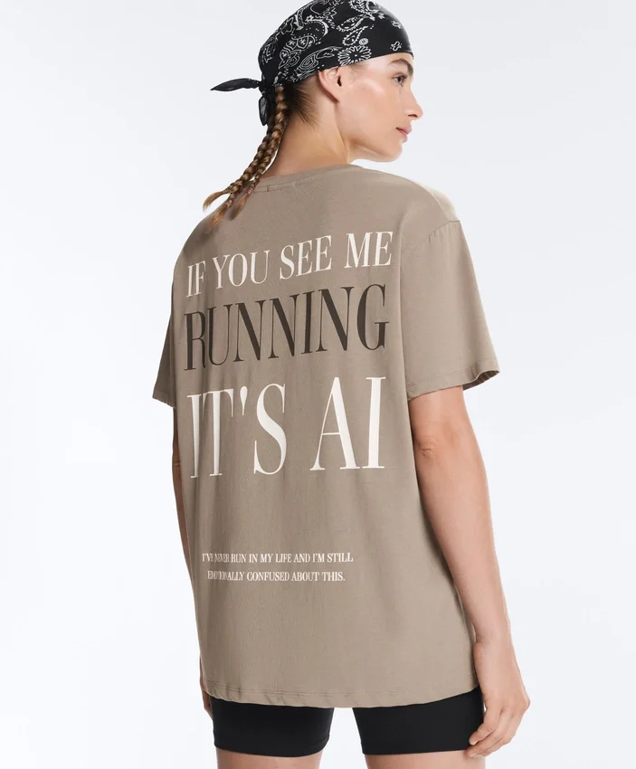 T-shirt larga de manga curta em mistura de algodão com slogan T-shirt larga de manga curta em mistura de algodão com slogan