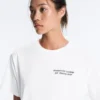 T-shirt larga em mistura de algodão com slogan T-shirt larga em mistura de algodão com slogan