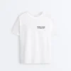 T-shirt larga em mistura de algodão com slogan T-shirt larga em mistura de algodão com slogan