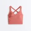 Tops Comfortlux sem mangas com corte cruzado Tops Comfortlux sem mangas com corte cruzado