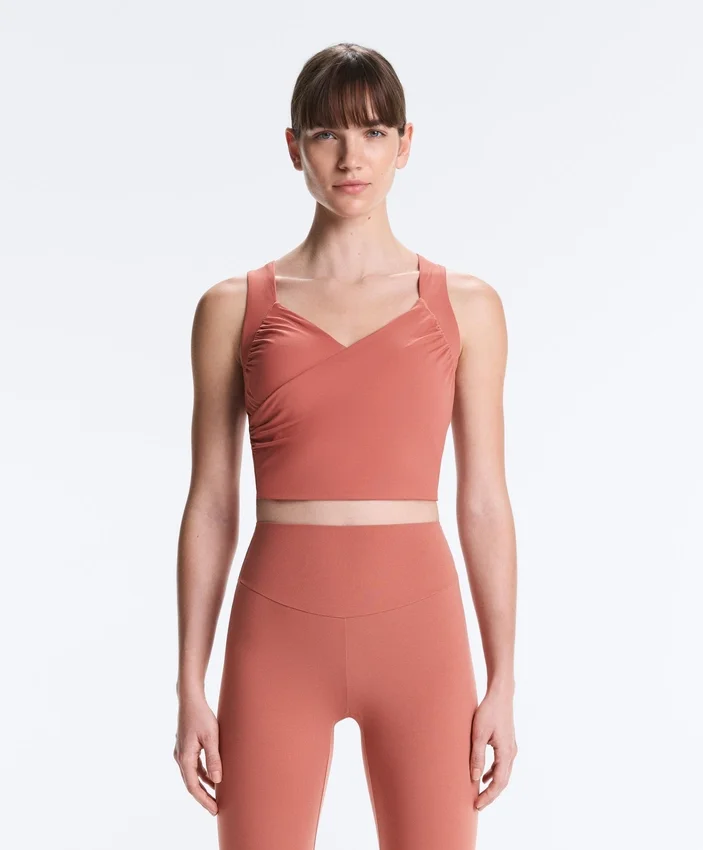 Tops Comfortlux sem mangas com corte cruzado Tops Comfortlux sem mangas com corte cruzado